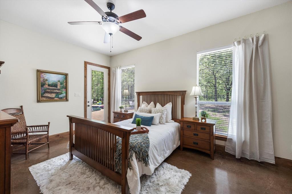 2702 Hidden Trails Road Royse City, TX 75189 - Photo 29 of 39 a bedroom with a bed and a window