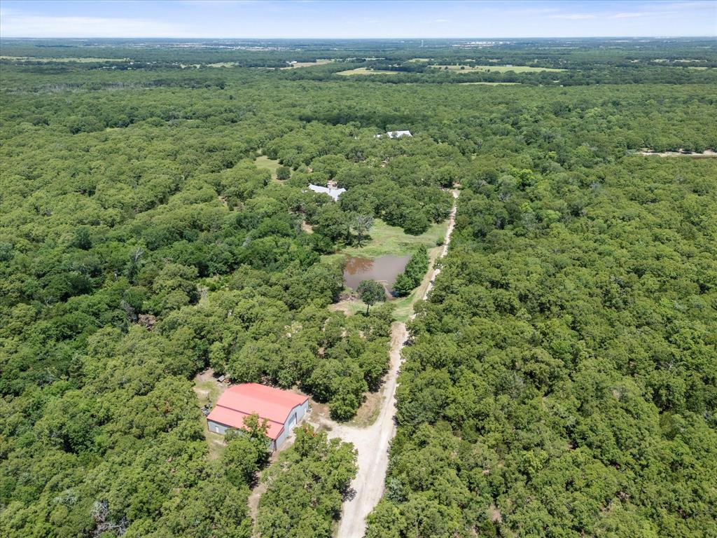 2702 Hidden Trails Road Royse City, TX 75189 - Photo 34 of 39 an aerial view of residential houses with outdoor space and trees