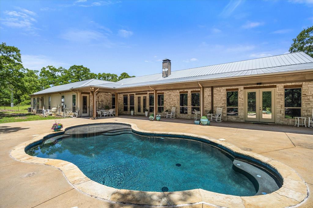 2702 Hidden Trails Road Royse City, TX 75189 - Photo 37 of 39 a view of a house with swimming pool and a yard