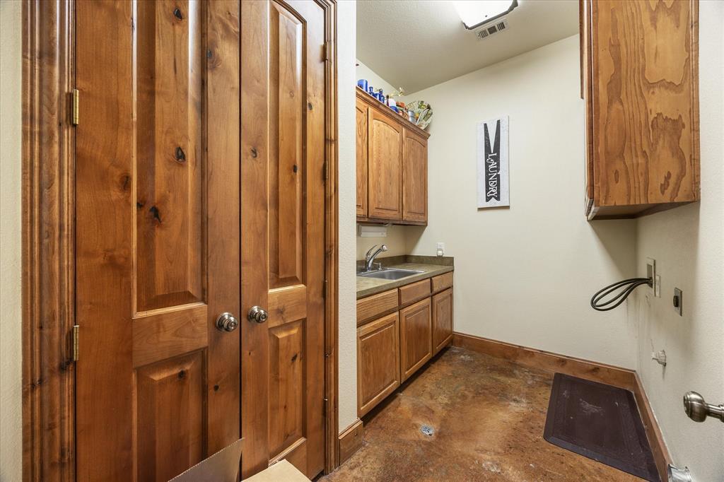 2702 Hidden Trails Road Royse City, TX 75189 - Photo 39 of 39 a bathroom with a granite countertop sink and a mirror