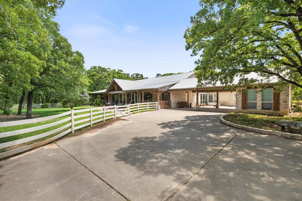 2702 Hidden Trails Road Royse City, TX 75189 - Photo 5 of 39 a front view of a house with a garden
