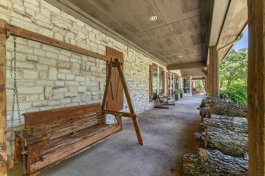 2702 Hidden Trails Road Royse City, TX 75189 - Photo 7 of 39 a living room with patio furniture and a floor to ceiling window