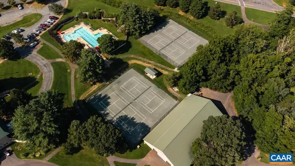 view of swimming pool from a balcony
