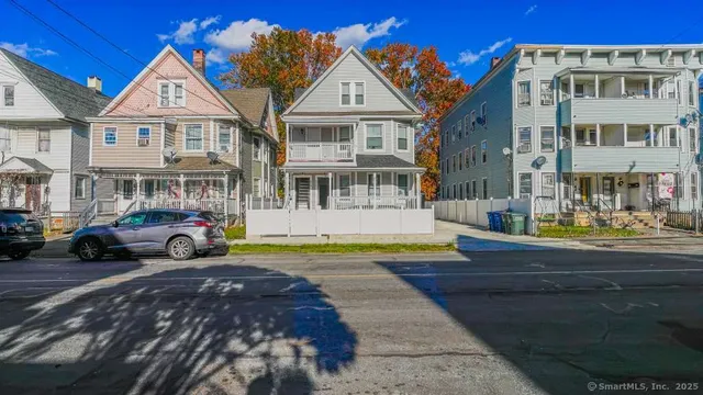 a view of multiple houses with a yard
