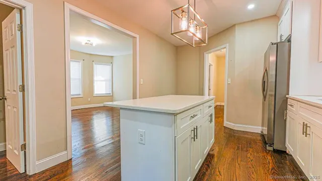 a bathroom with a sink a mirror and a shower