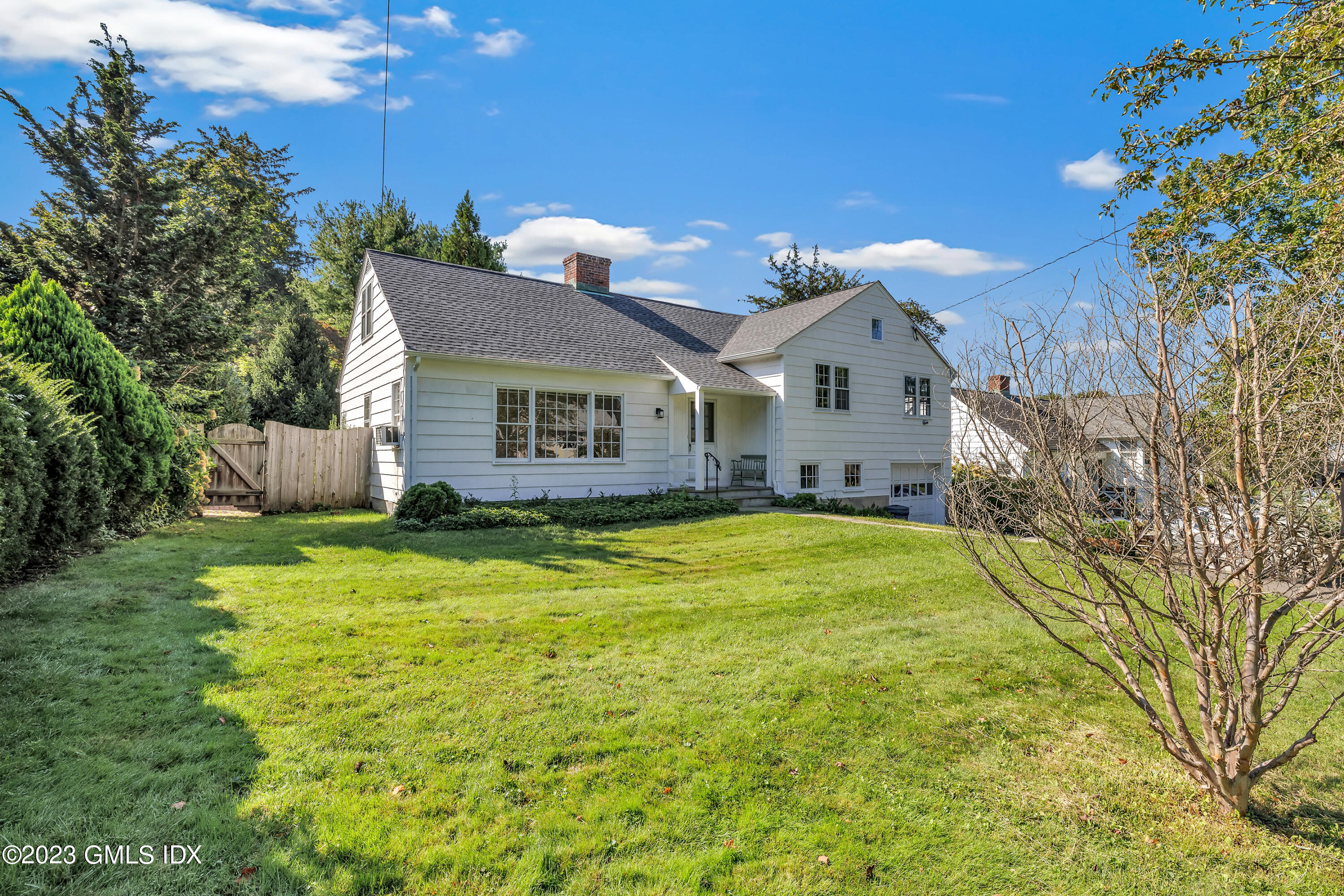 20 Bayside Terrace Riverside, CT 06878 - Photo 1 of 30 a front view of a house with a yard