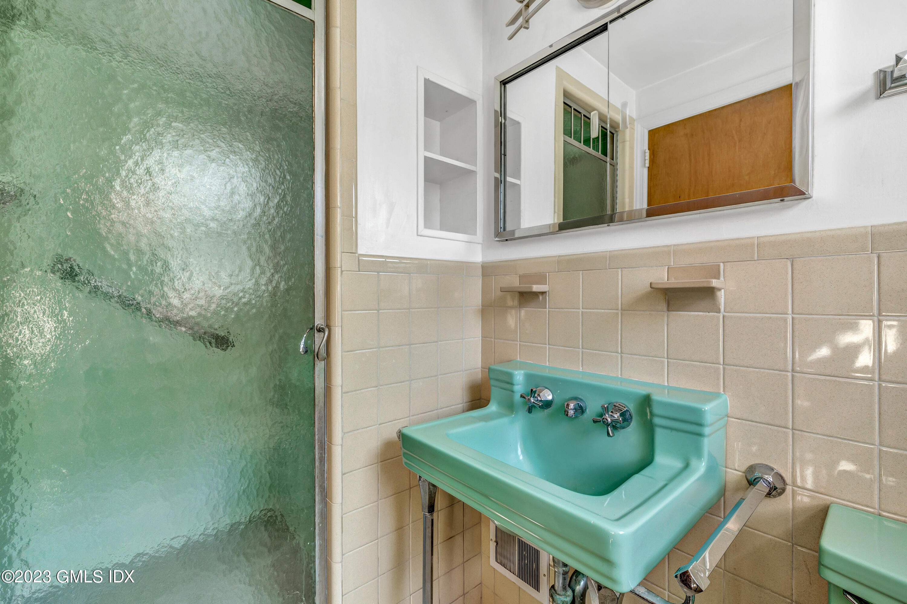 20 Bayside Terrace Riverside, CT 06878 - Photo 17 of 30 a bathroom with a sink and mirror