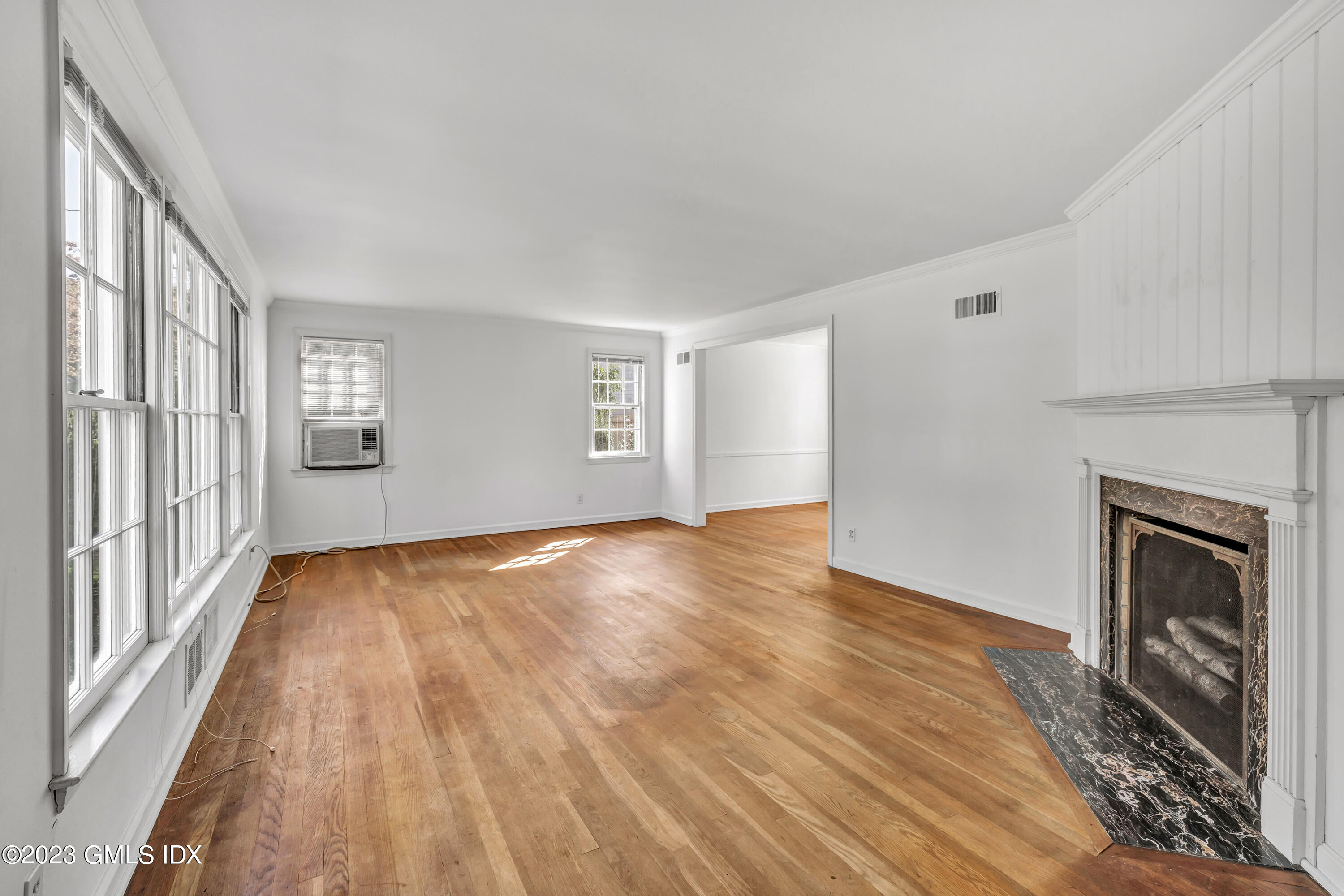 20 Bayside Terrace Riverside, CT 06878 - Photo 3 of 30 wooden floor fireplace and natural light in room