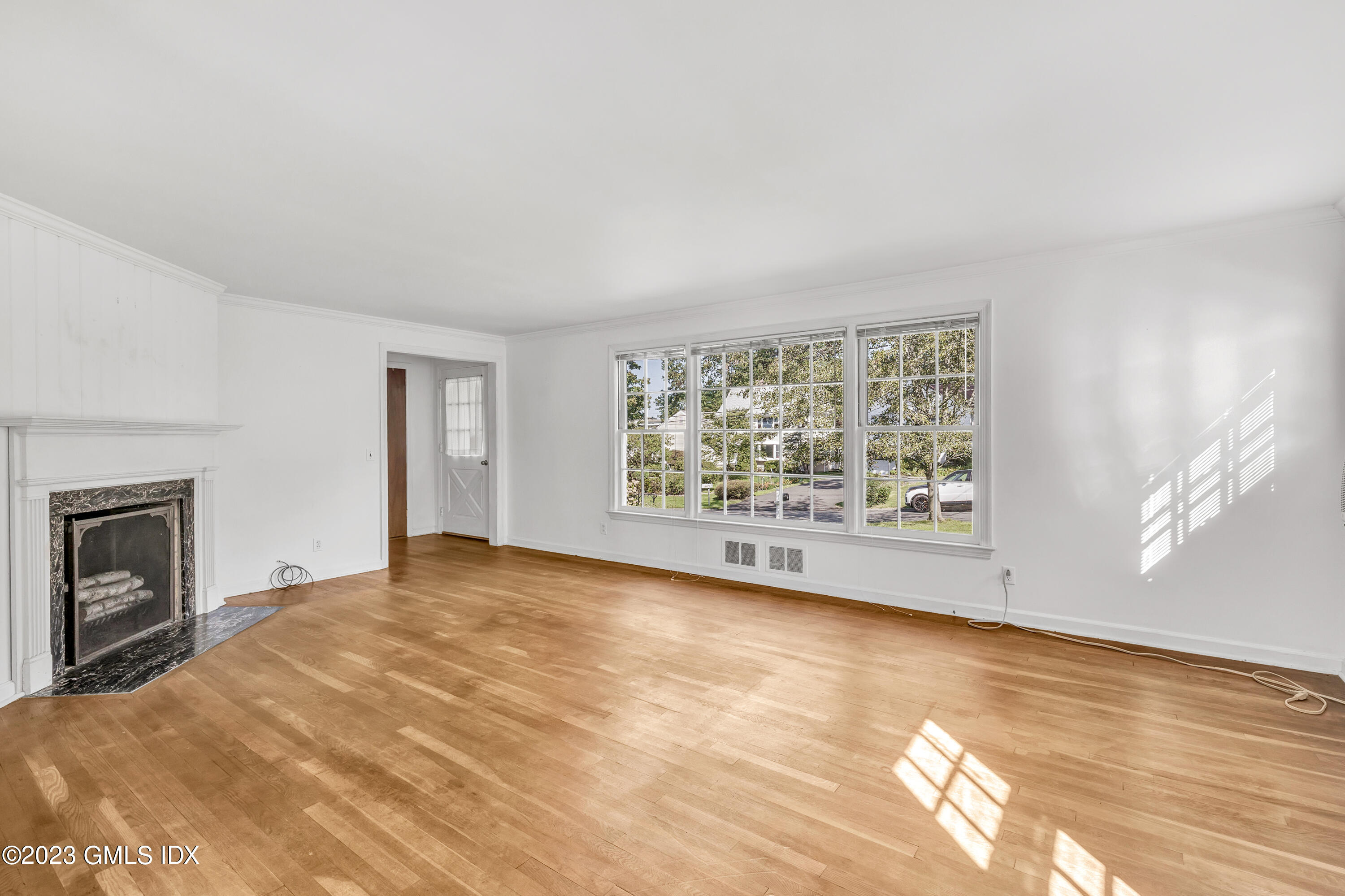 20 Bayside Terrace Riverside, CT 06878 - Photo 4 of 30 a view of an empty room with a fireplace and a window