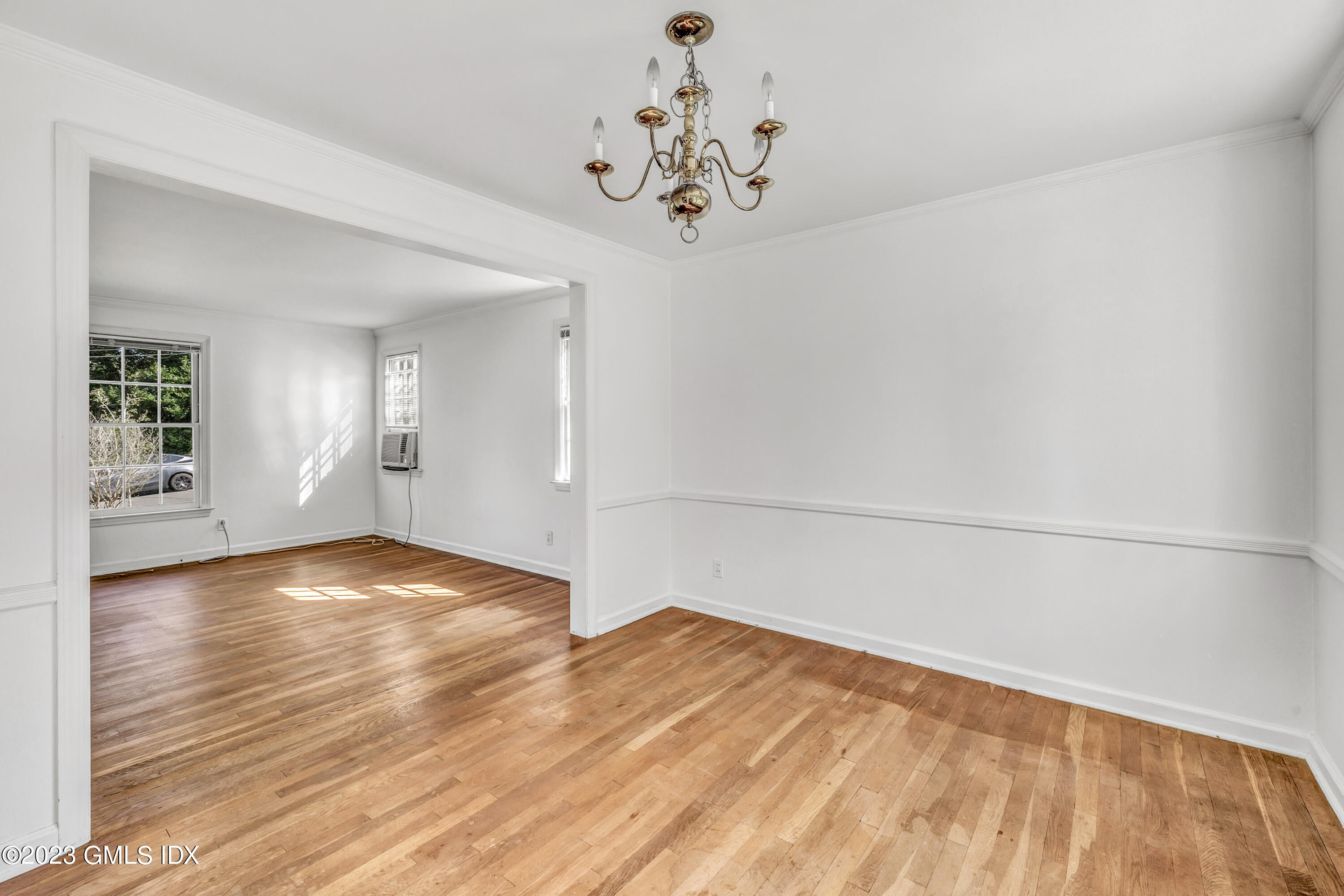 20 Bayside Terrace Riverside, CT 06878 - Photo 7 of 30 a view of a room with wooden floor and chandelier