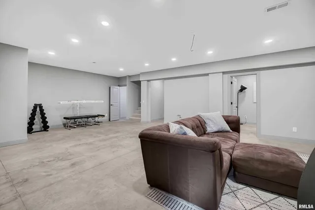 a front view of a house with a garden and yard