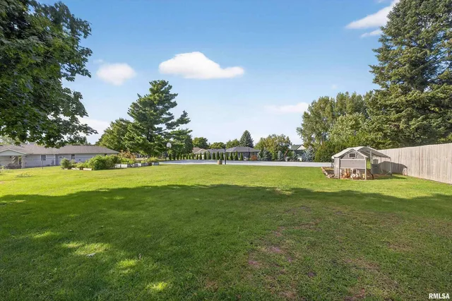 a view of swimming pool with a yard