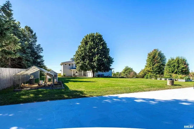 a bedroom with a bed and a dresser in it