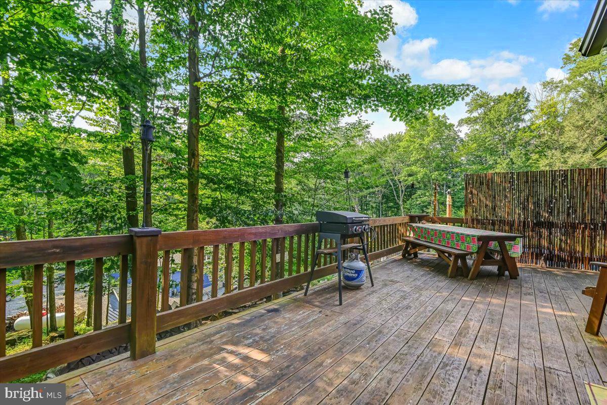 112 Beechwood Cove Road Greentown, PA 18426 - Photo 7 of 59 a view of a two chairs on the deck