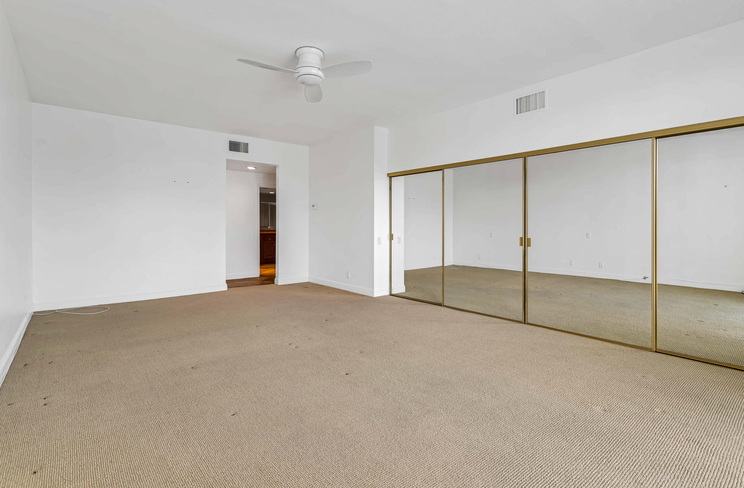 910 Island Drive, Unit 211 Rancho Mirage, CA 92270 - Photo 15 of 38 an empty room with fan