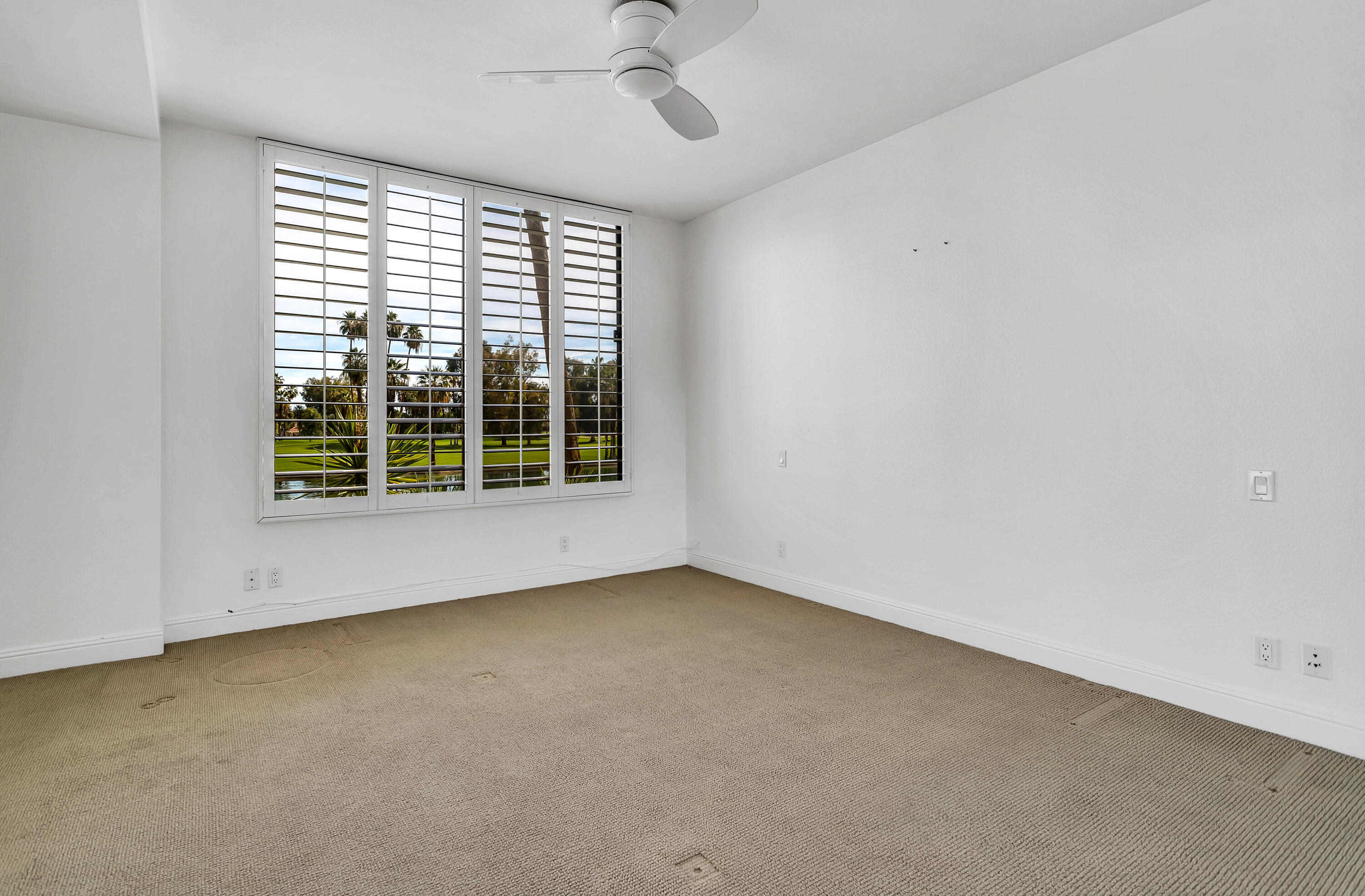 910 Island Drive, Unit 211 Rancho Mirage, CA 92270 - Photo 20 of 38 an empty room with a window