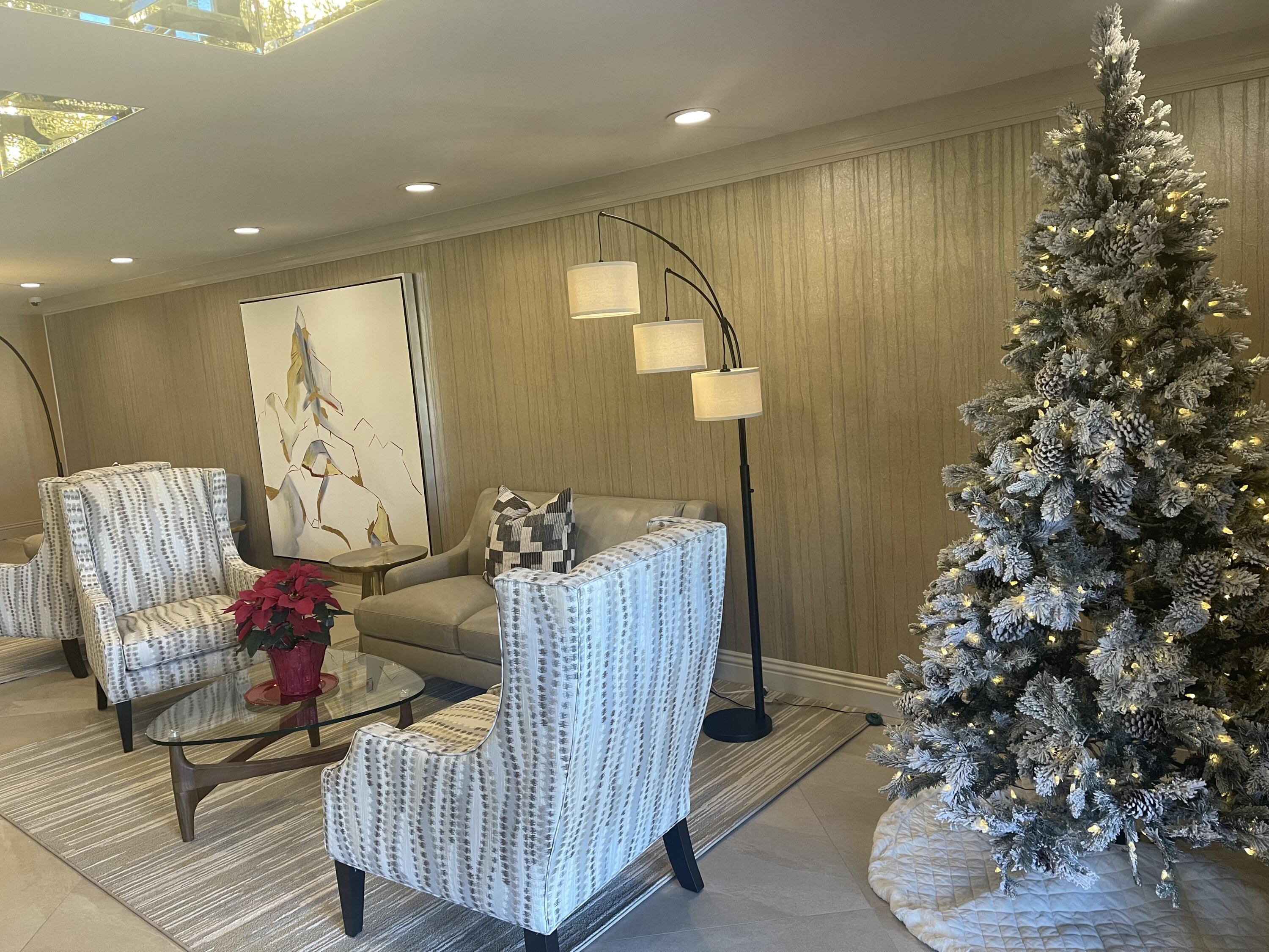 910 Island Drive, Unit 211 Rancho Mirage, CA 92270 - Photo 29 of 38 a living room with furniture and flowers