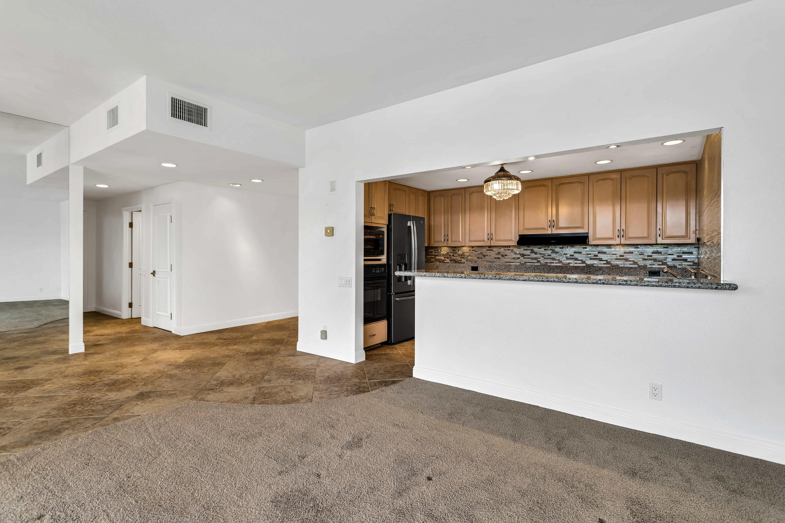 910 Island Drive, Unit 211 Rancho Mirage, CA 92270 - Photo 8 of 38 a view of kitchen and refrigerator