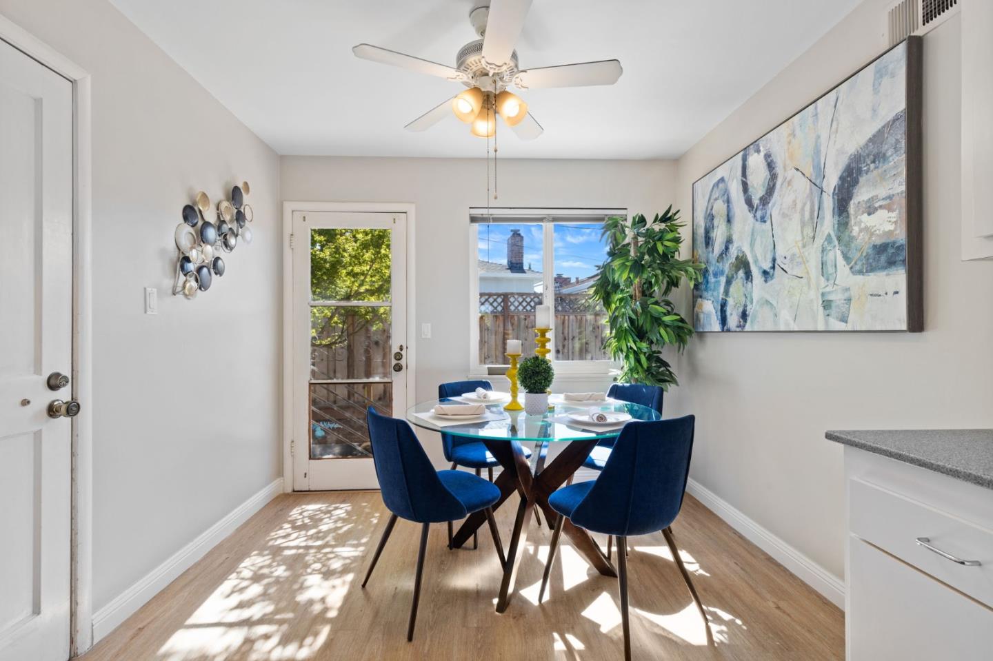 228 Spuraway Drive San Mateo, CA 94403 - Photo 11 of 20 a view of a dining room with furniture window and outside view