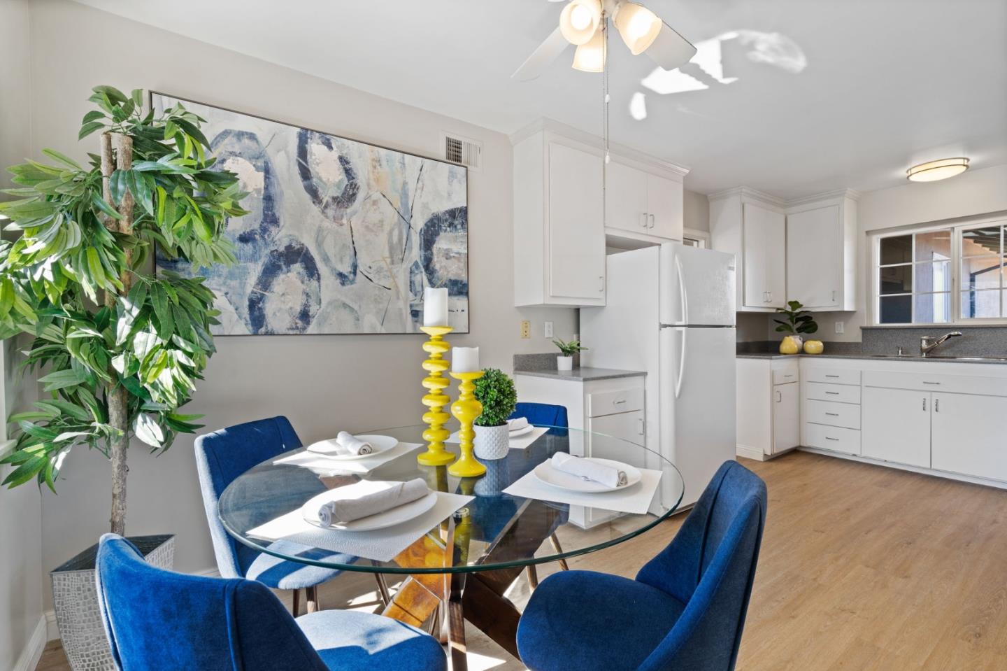 228 Spuraway Drive San Mateo, CA 94403 - Photo 12 of 20 a kitchen with stainless steel appliances dining table and chairs