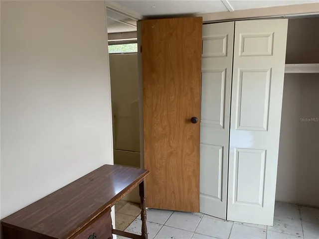 a view of a hallway with closet