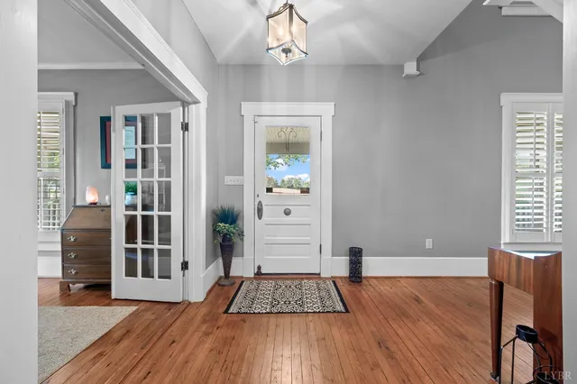 a living room with furniture fireplace and window