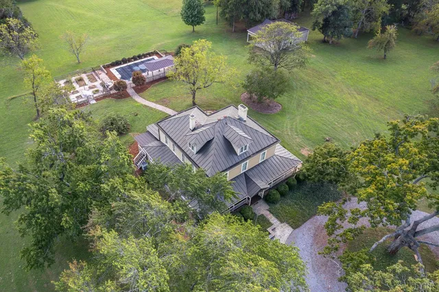 a view of a hallway view with wooden floor and staircase