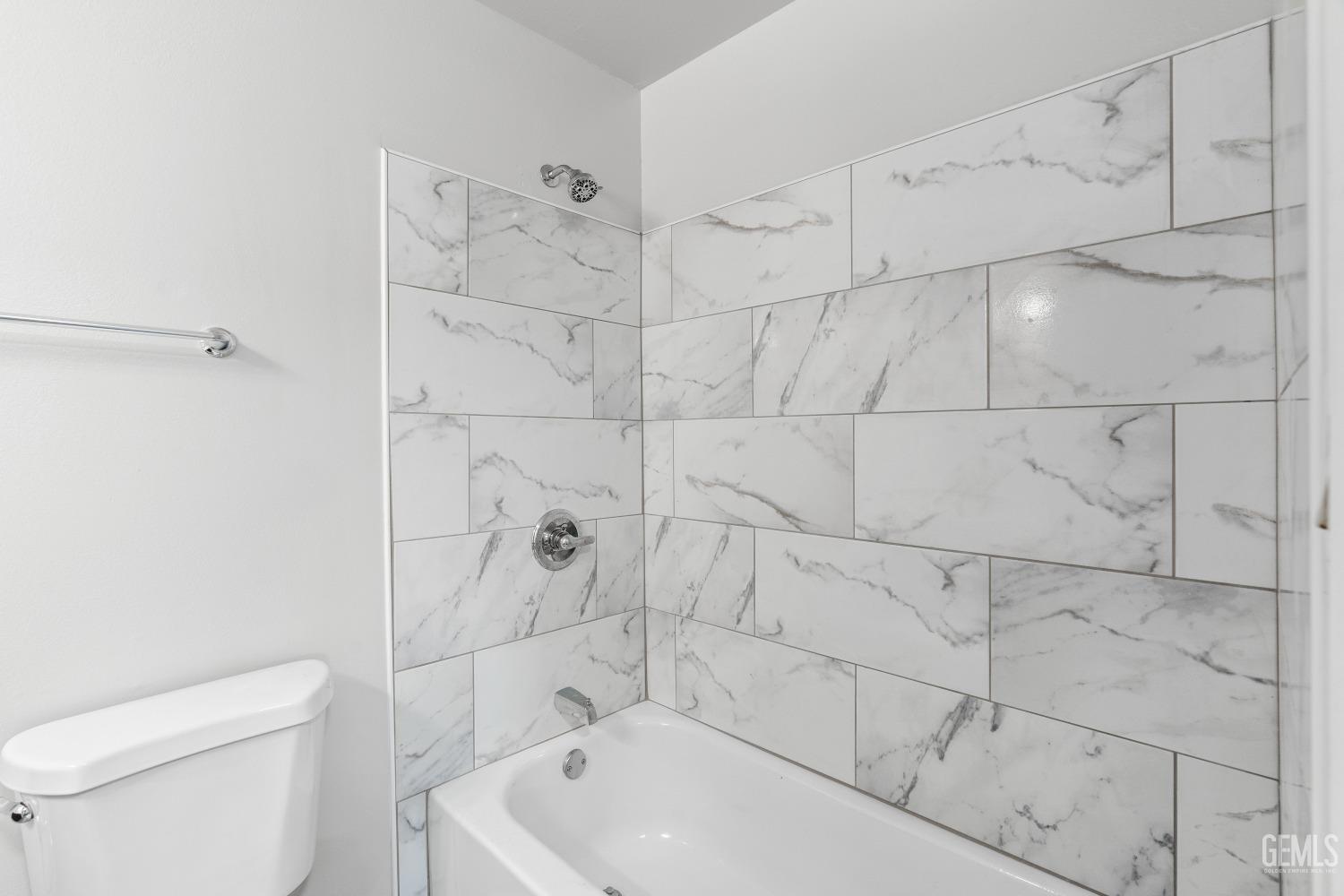 Undisclosed Address Santa Maria, CA 93455 - Photo 20 of 34 a bathroom with a bathtub and toilet