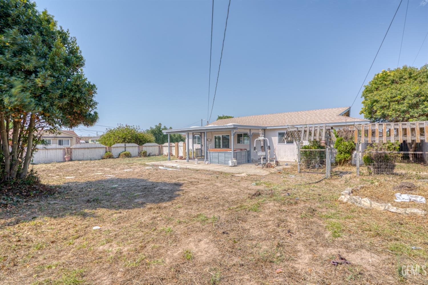 Undisclosed Address Santa Maria, CA 93455 - Photo 28 of 34 a view of a house with a yard and potted plants