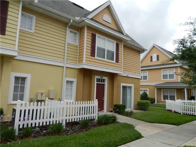2607 Gala Road North, Unit 102 Kissimmee, FL 34746 - Photo 1 of 1 a front view of a house with garden