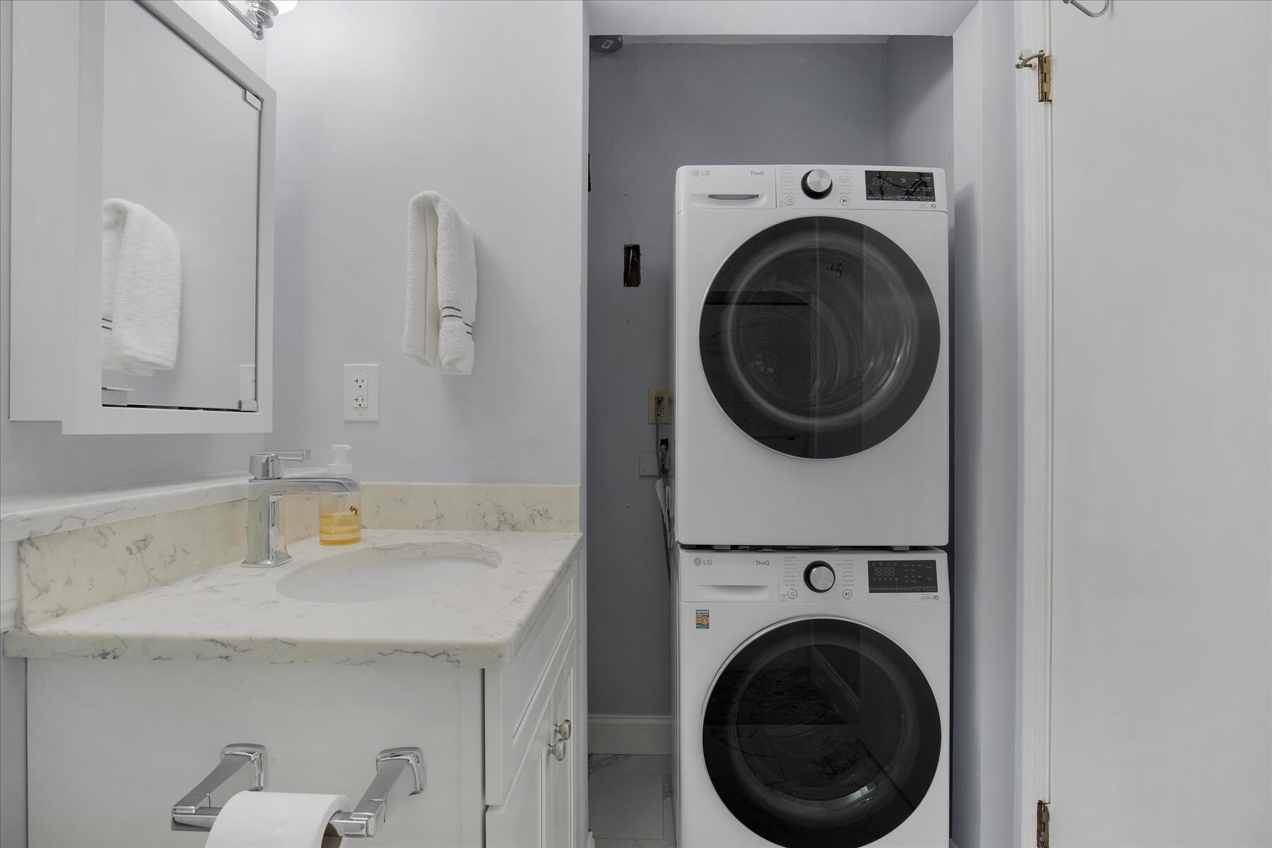 800 Bearses Way, Unit 1EB Hyannis, MA 02601 - Photo 19 of 37 a utility room with sink dryer and washer