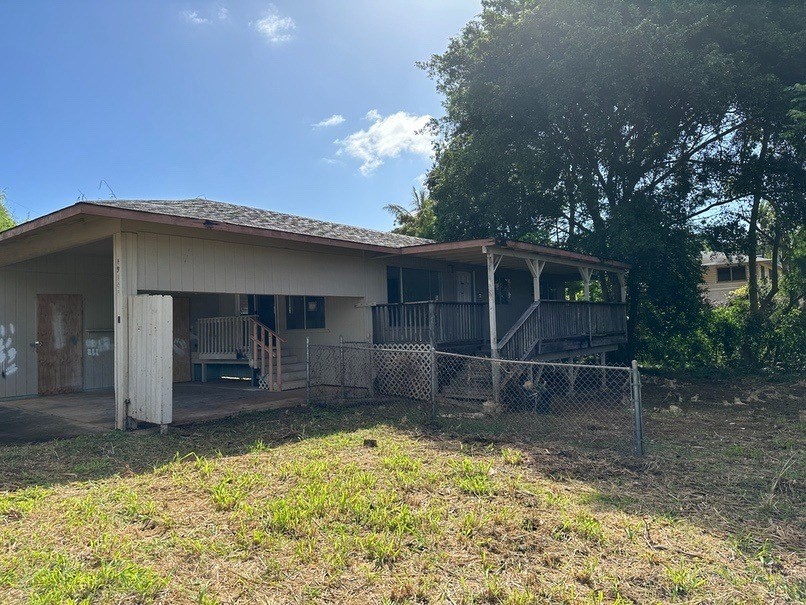 4914 D Hekili Road Kapaa, HI 96746 - Photo 2 of 17 a backyard of a house with yard and garage