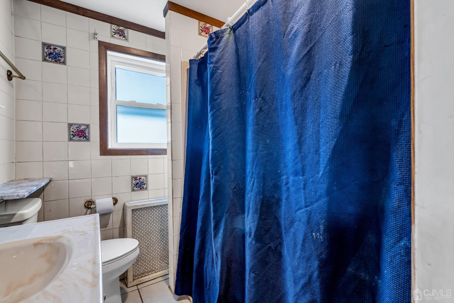 40 Farrington Road Old Bridge, NJ 07747 - Photo 16 of 49 a bathroom with a toilet a sink and a mirror