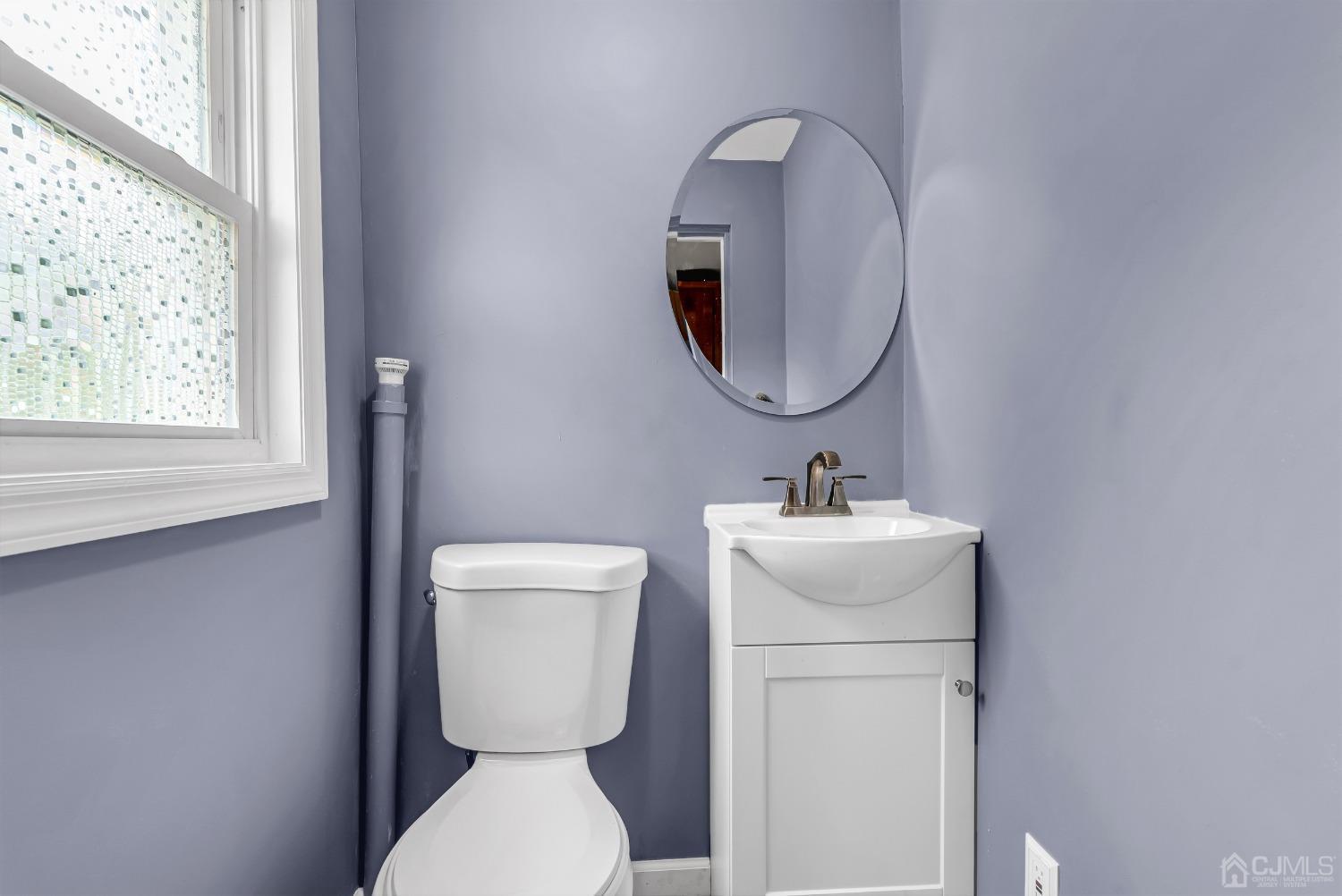 40 Farrington Road Old Bridge, NJ 07747 - Photo 17 of 49 a bathroom with a toilet a sink and a mirror