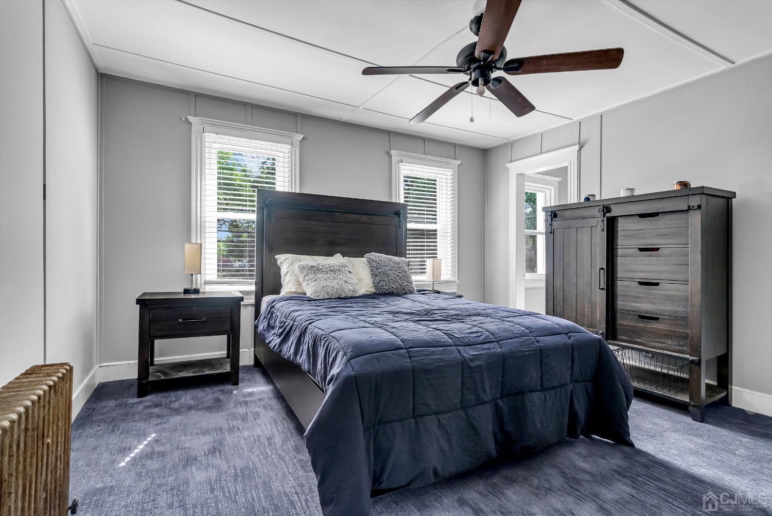 40 Farrington Road Old Bridge, NJ 07747 - Photo 19 of 49 a bedroom with a bed and a chandelier