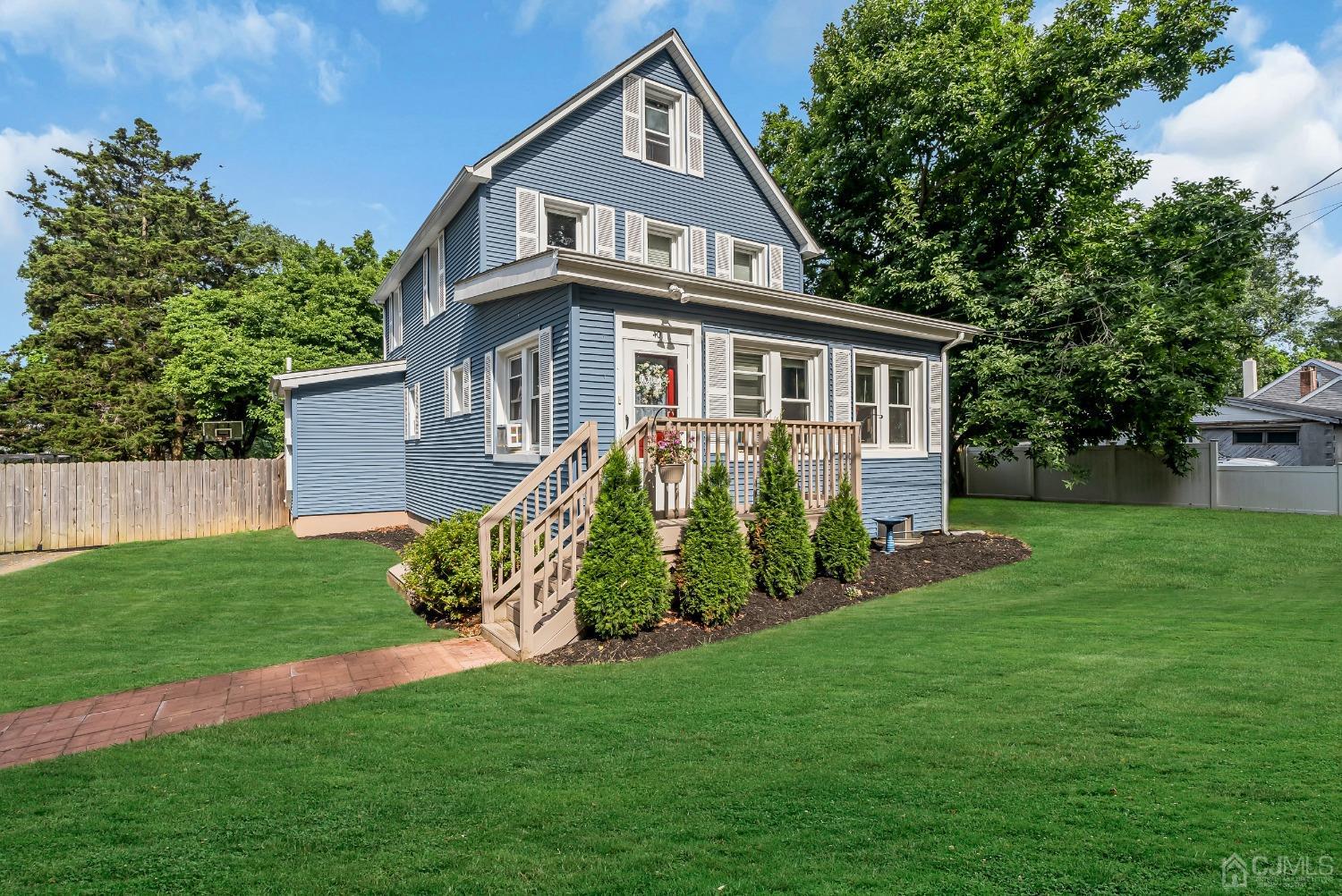 40 Farrington Road Old Bridge, NJ 07747 - Photo 24 of 49 a front view of a house with a yard and trees