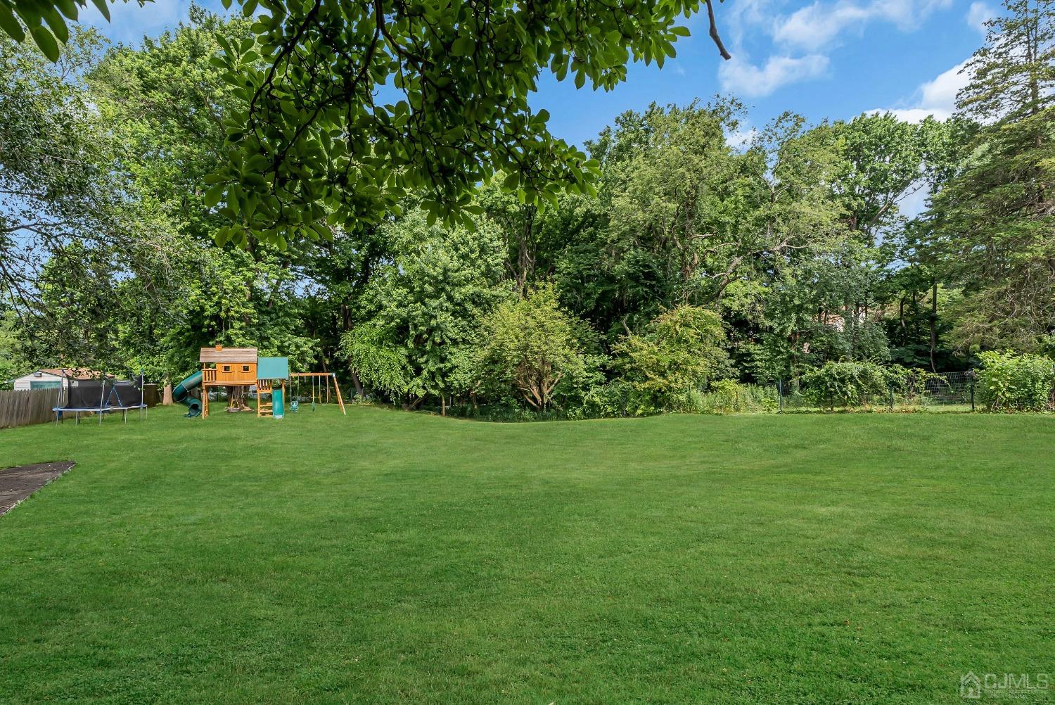 40 Farrington Road Old Bridge, NJ 07747 - Photo 37 of 49 a backyard of a house with lots of green space