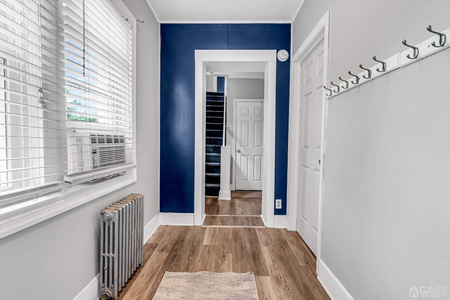 40 Farrington Road Old Bridge, NJ 07747 - Photo 4 of 49 a view of a hallway with wooden floor and staircase