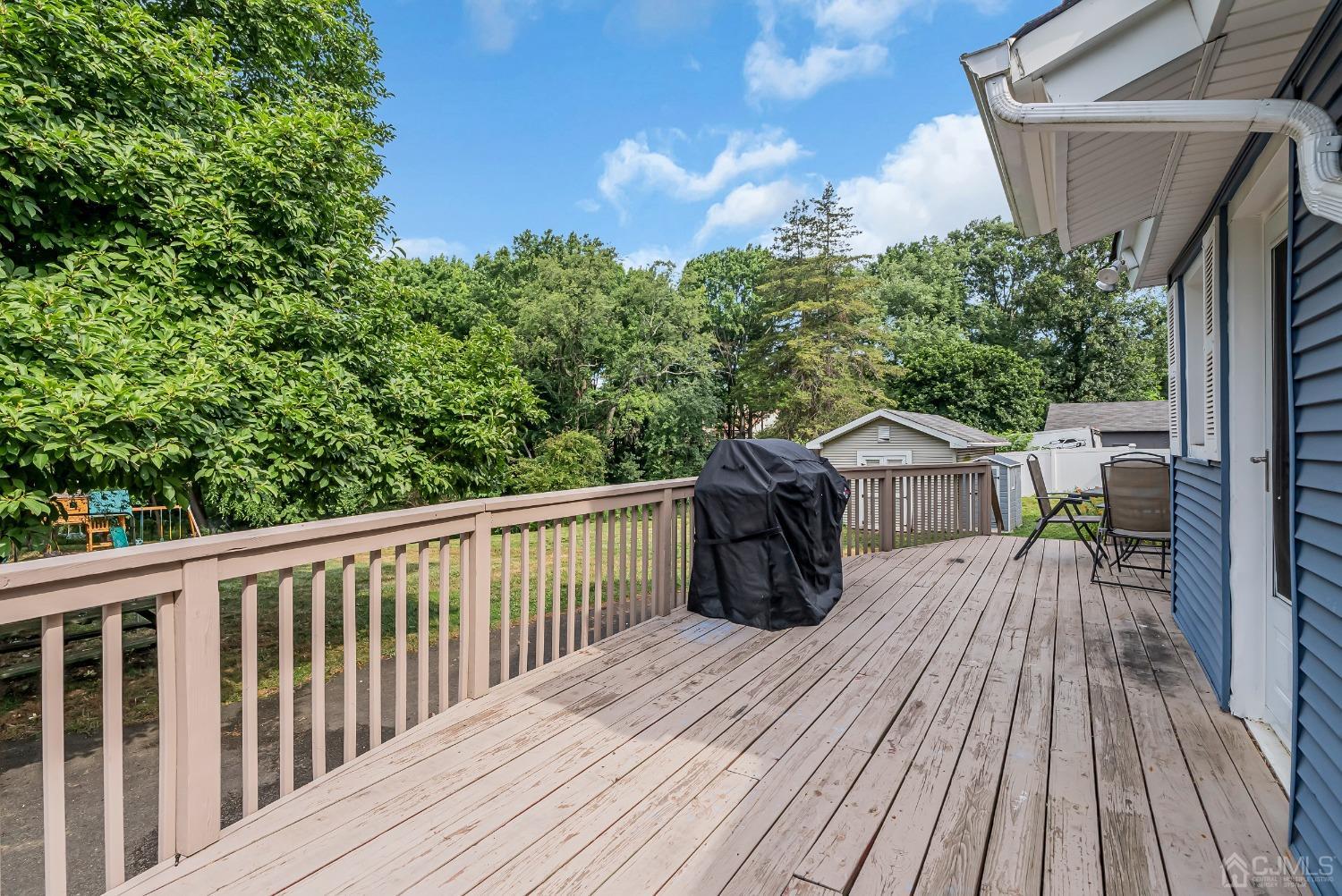 40 Farrington Road Old Bridge, NJ 07747 - Photo 47 of 49 a view of a house with a wooden deck and a garden