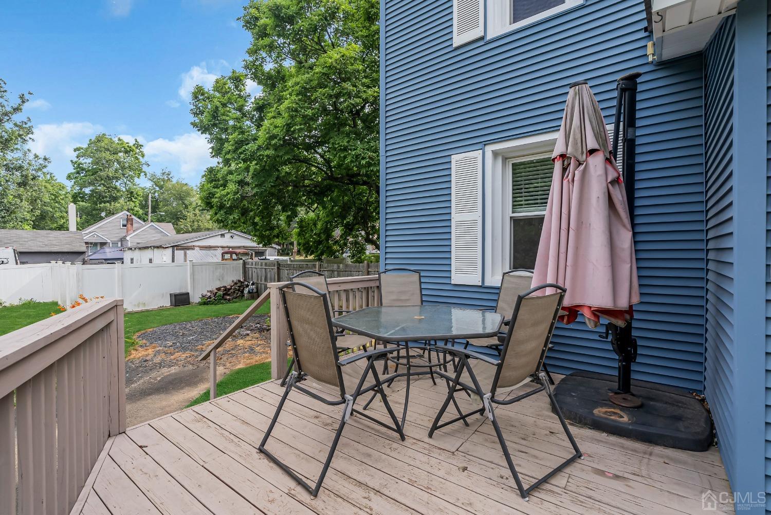 40 Farrington Road Old Bridge, NJ 07747 - Photo 48 of 49 a view of a table and chairs in patio of the house