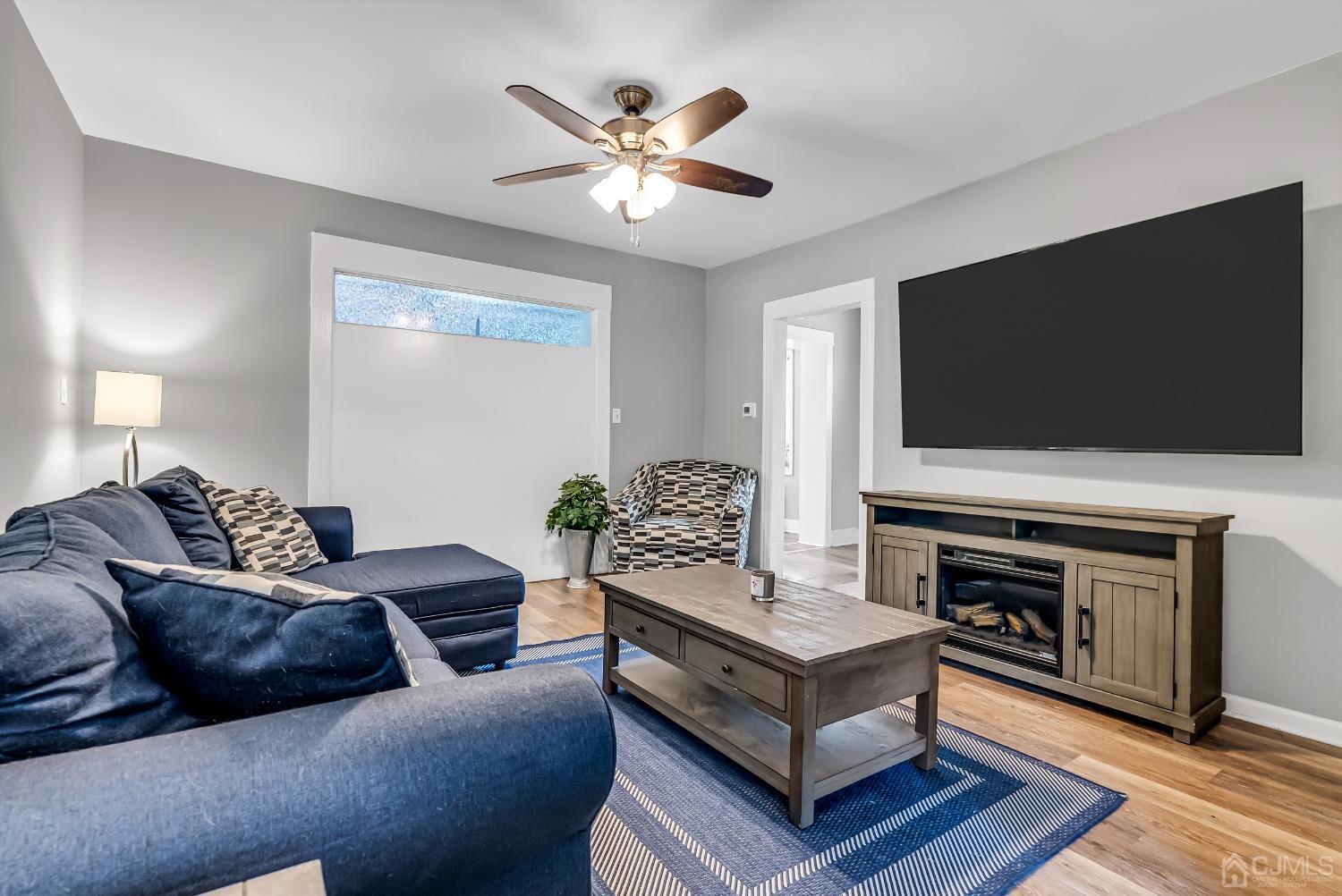 40 Farrington Road Old Bridge, NJ 07747 - Photo 6 of 49 a living room with furniture and a flat screen tv