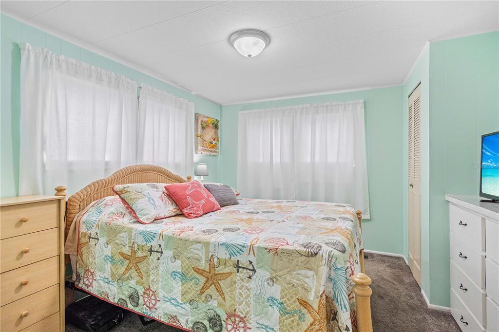 24437 Harbor View Road, Unit 55 Punta Gorda, FL 33980 - Photo 12 of 23 a bedroom with a bed and a window