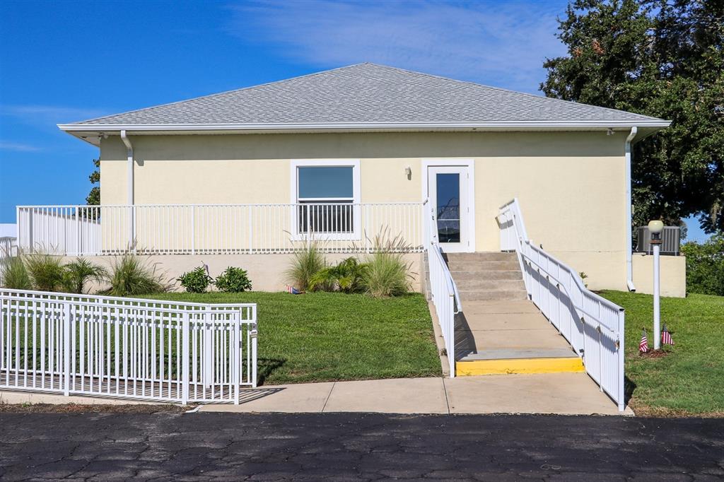 24437 Harbor View Road, Unit 55 Punta Gorda, FL 33980 - Photo 15 of 23 a front view of house with yard