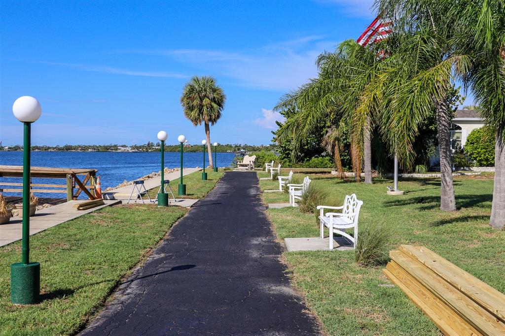24437 Harbor View Road, Unit 55 Punta Gorda, FL 33980 - Photo 17 of 23 a view of a park with large trees