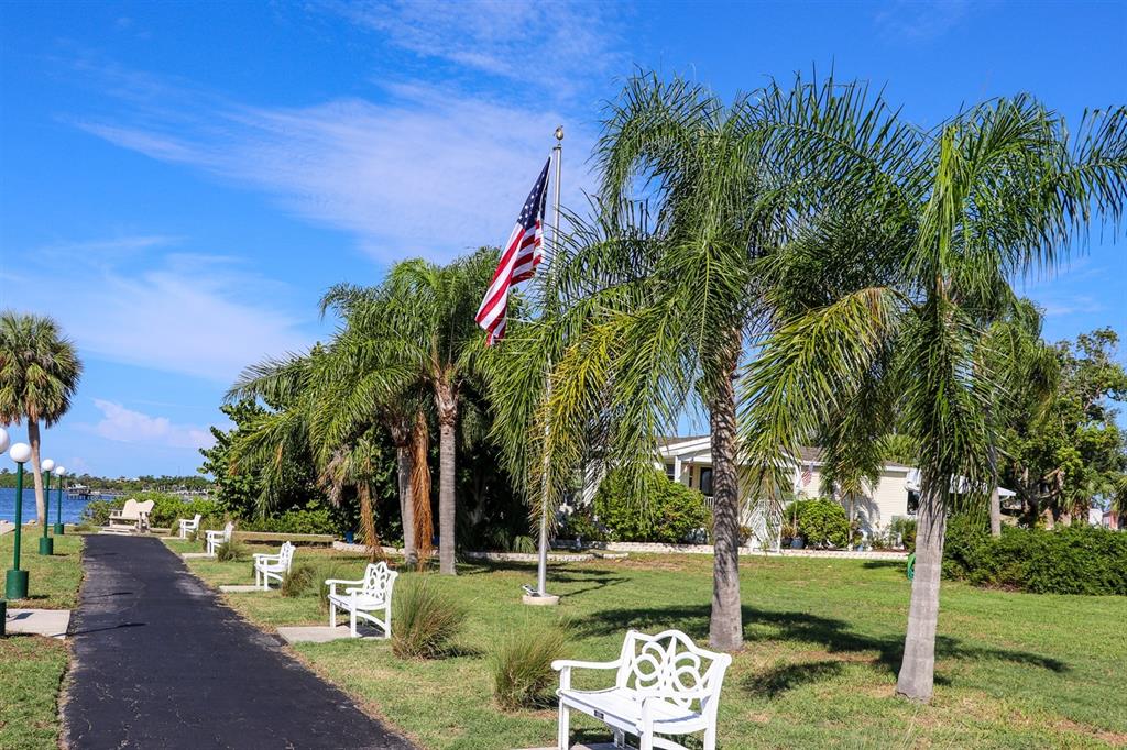 24437 Harbor View Road, Unit 55 Punta Gorda, FL 33980 - Photo 22 of 23 a view of a park with large trees