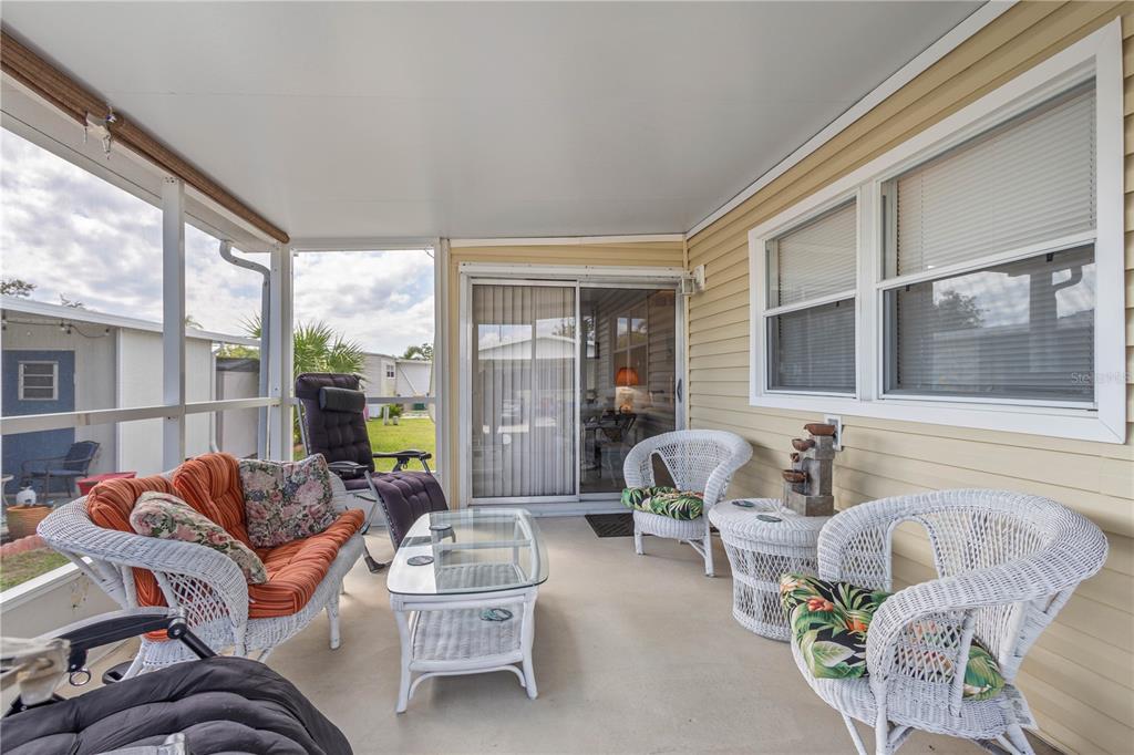 24437 Harbor View Road, Unit 55 Punta Gorda, FL 33980 - Photo 3 of 23 a living room with furniture and a large window