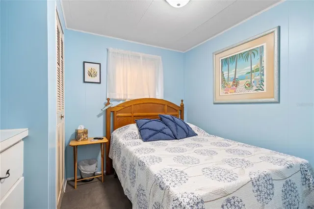 a bedroom with a bed and a closet