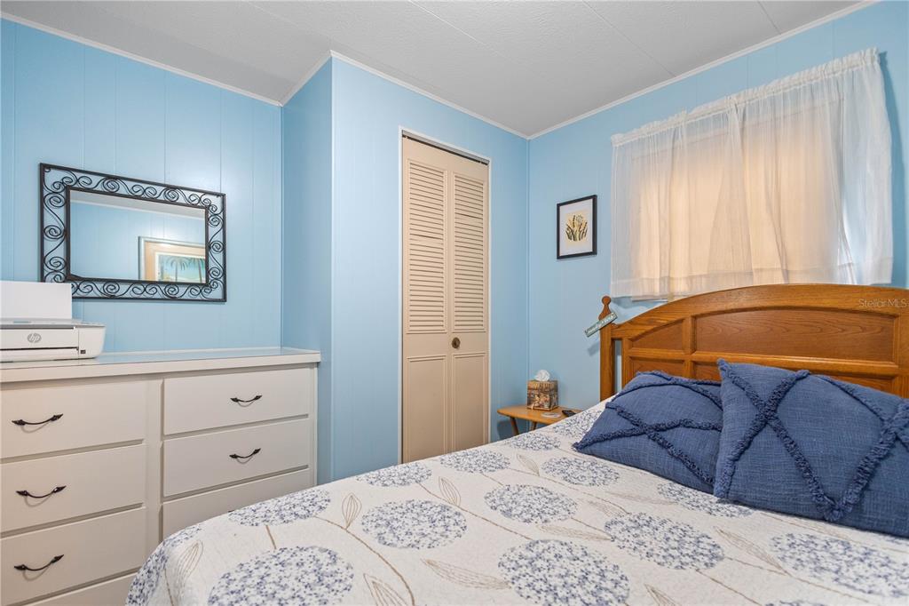 24437 Harbor View Road, Unit 55 Punta Gorda, FL 33980 - Photo 10 of 23 a bedroom with a bed and a closet