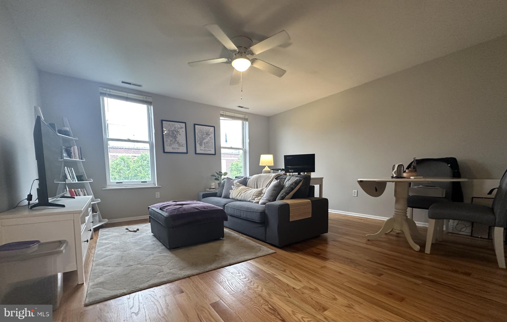 1608 South Street, Unit 3 Philadelphia, PA 19146 - Photo 1 of 10 a living room with furniture and a large window