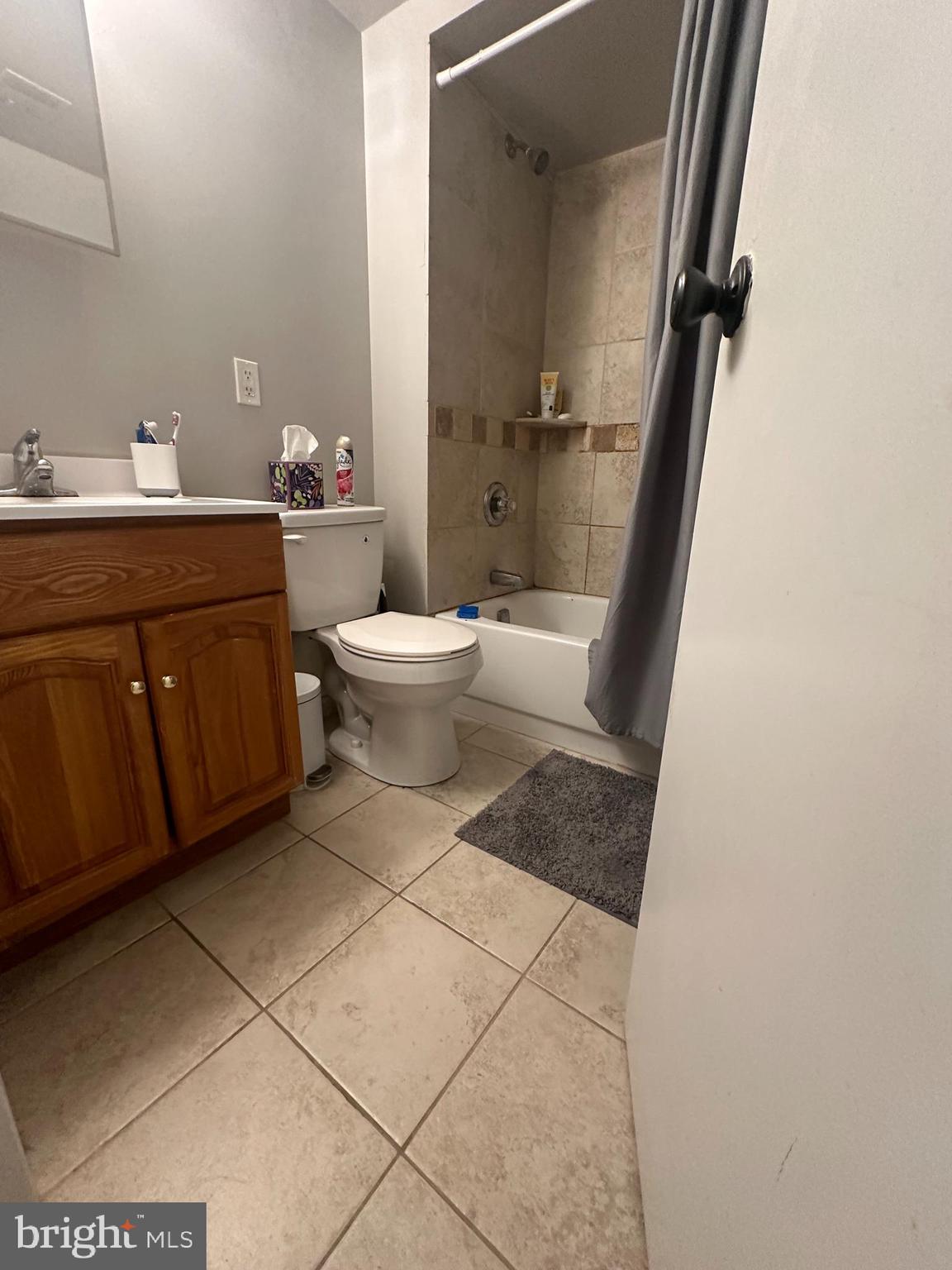 1608 South Street, Unit 3 Philadelphia, PA 19146 - Photo 8 of 10 a bathroom with a sink a toilet and shower
